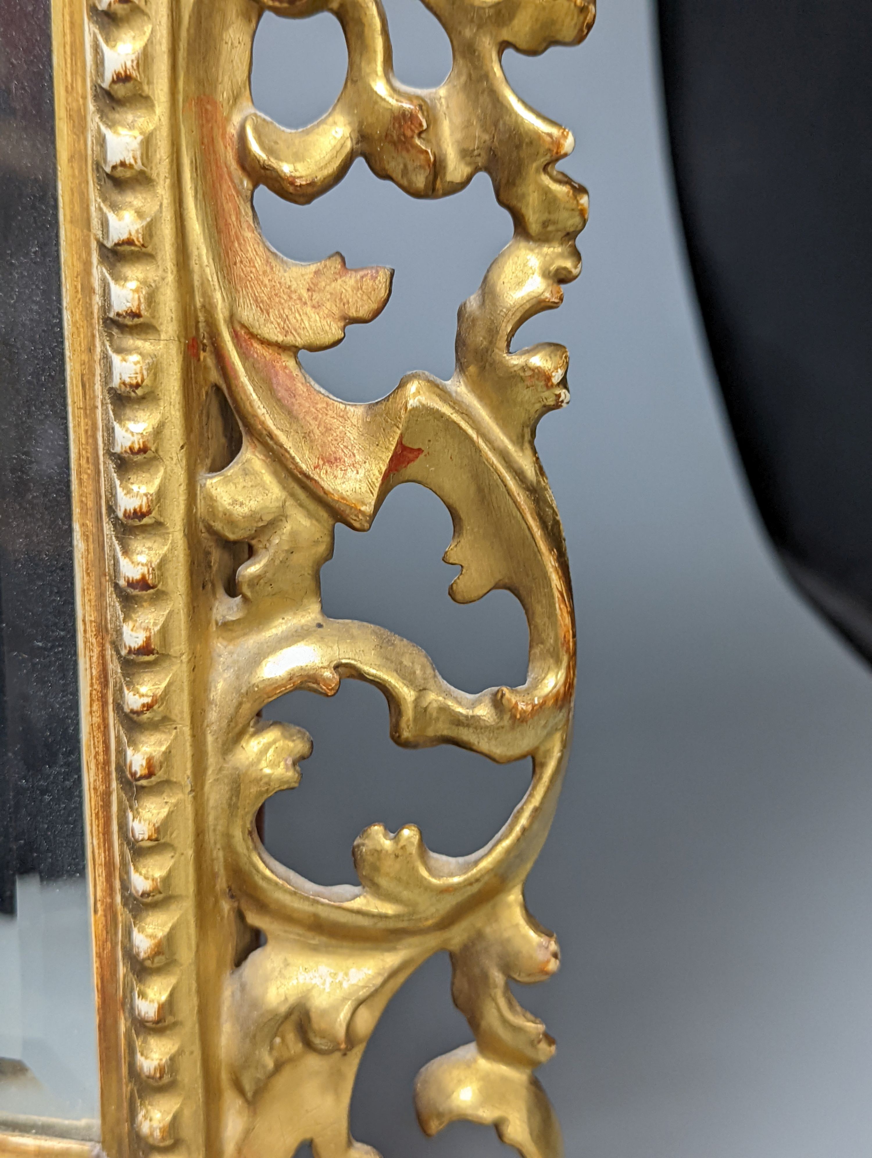 A Florentine giltwood framed mirror, with later easel back, 54 cms high x 43 cms wide.